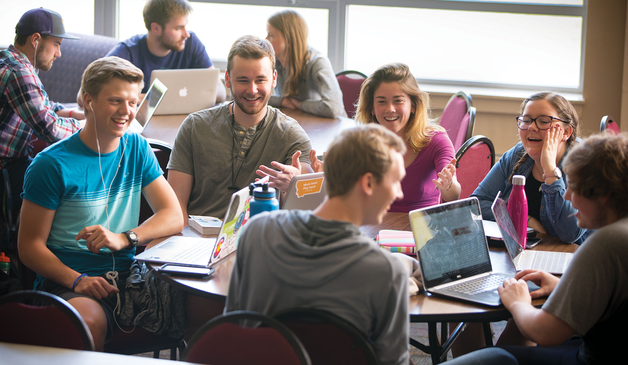 Group of students at table in Campus Center