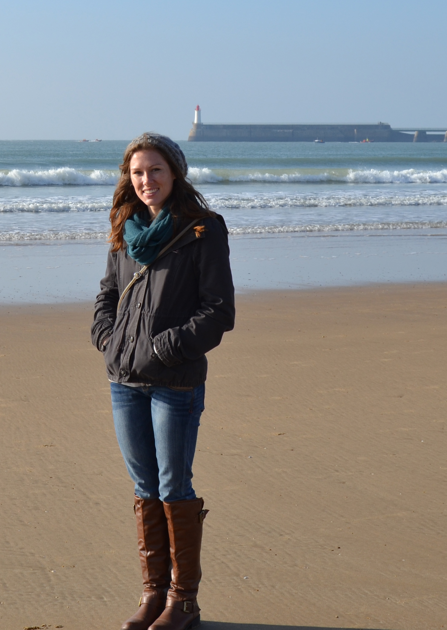 Elizabeth Baker on the beach with the ocean in the background