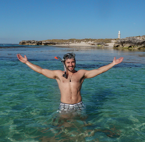 Snapshot of Mike Nania standing in the ocean with a snorkle on