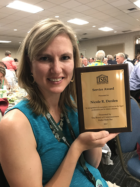 Photo of Nicole Derden Holding her Award