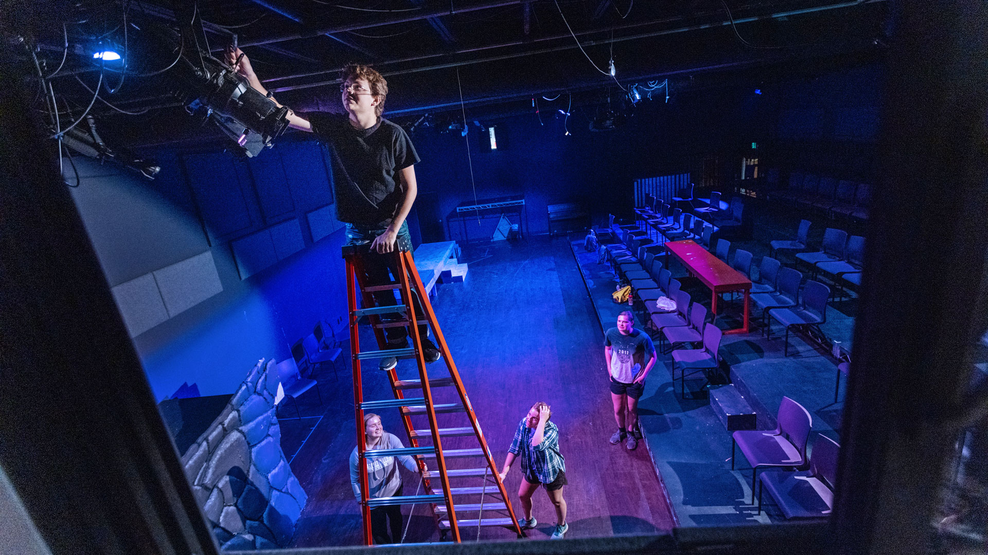 Student working on theater set