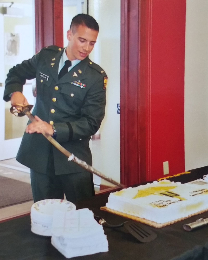 Nick Pacella cutting his cake at ROTC commissioning ceremony in May 2004.