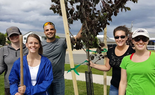 Jessica planting trees with colleagues in Helena