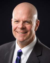Dr. John E. Cech