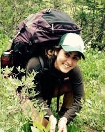 Snapshot of Laura Kohler backpacking in the forest