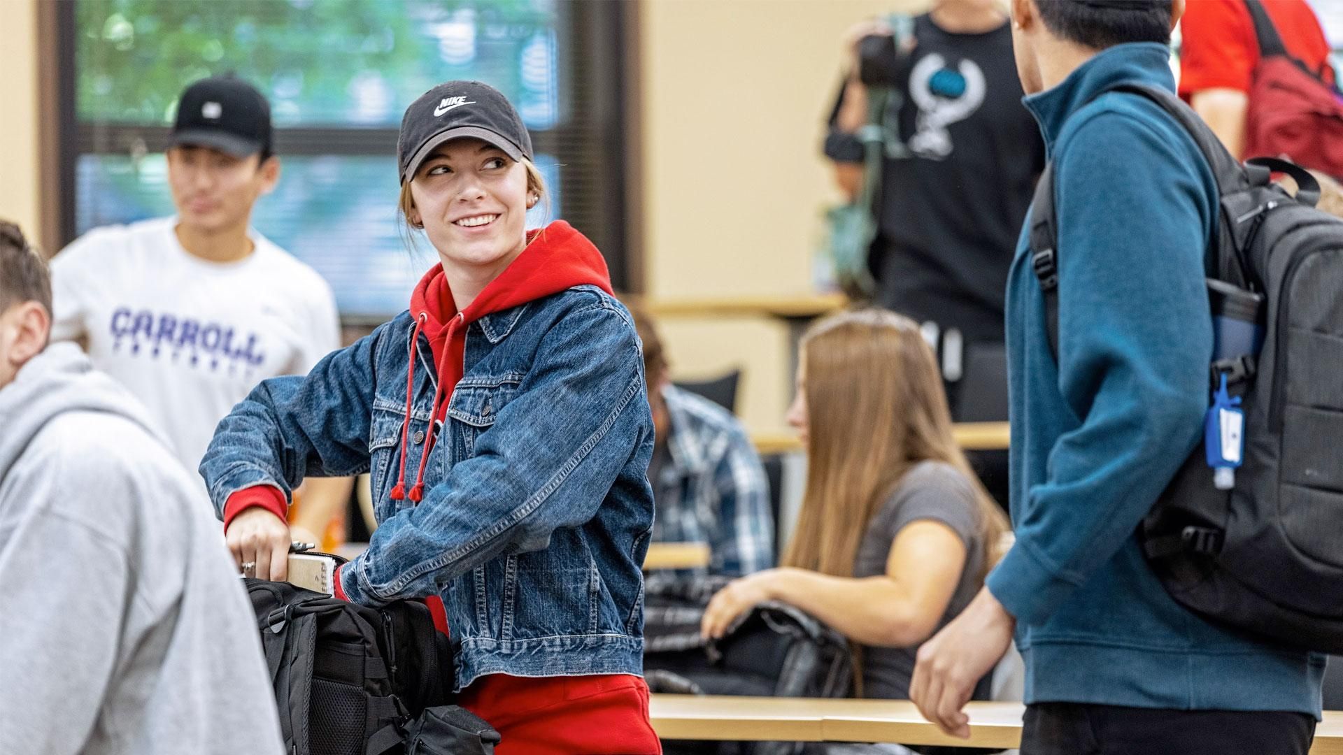 Female student in the classroom smiling